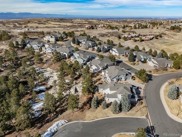 birds eye view of property with a residential view and a mountain view