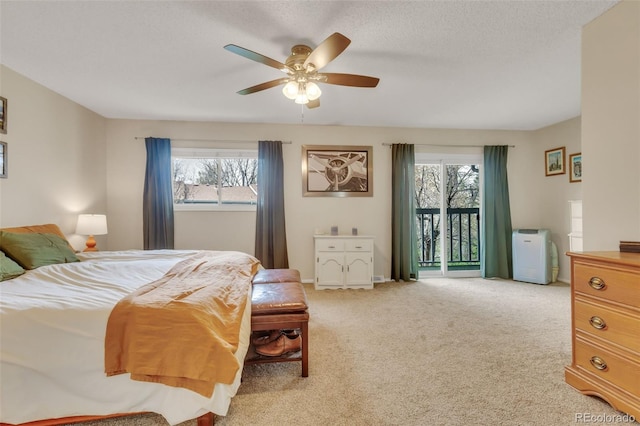 387 Upham St, Lakewood, CO 80226 - carpeted bedroom featuring access to outside, multiple windows, and a ceiling fan