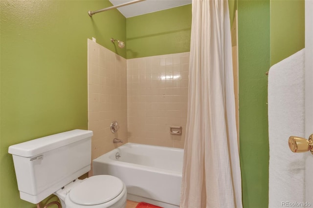 387 Upham St, Lakewood, CO 80226 - bathroom with toilet, shower / bath combo, and a textured wall