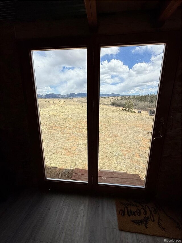 125 Chamber Ln, Jefferson, CO 80456 - doorway with beamed ceiling and wood finished floors