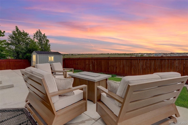 7099 E 123rd Pl, Thornton, CO 80602 - deck at dusk with outdoor lounge area and a fenced backyard