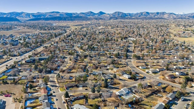 birds eye view of property featuring a mountain view