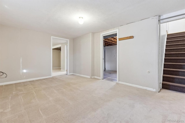 unfurnished room with light colored carpet