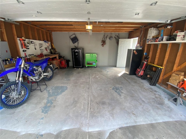 garage featuring a garage door opener and a workshop area