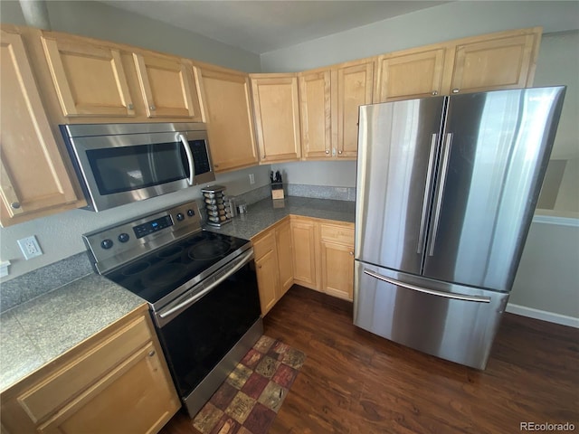 kitchen featuring dark wood-style floors, stainless steel appliances, tile counters, and light brown cabinetry