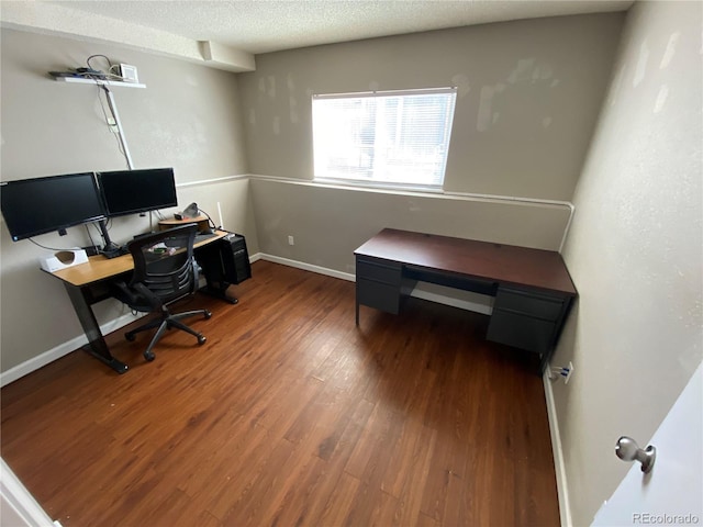 office featuring baseboards, a textured ceiling, and wood finished floors