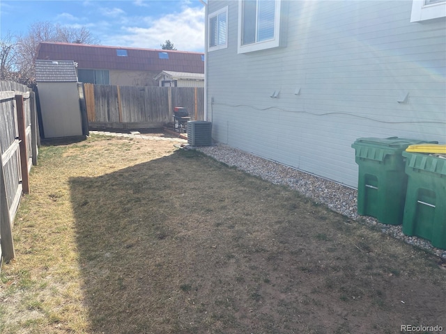 view of yard with a fenced backyard and cooling unit