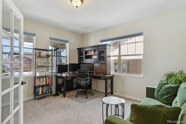 home office featuring carpet floors and baseboards