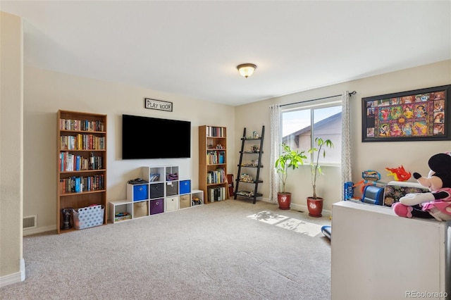 rec room with carpet flooring and baseboards