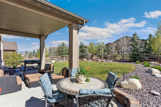 view of patio / terrace with outdoor dining area and an outdoor living space