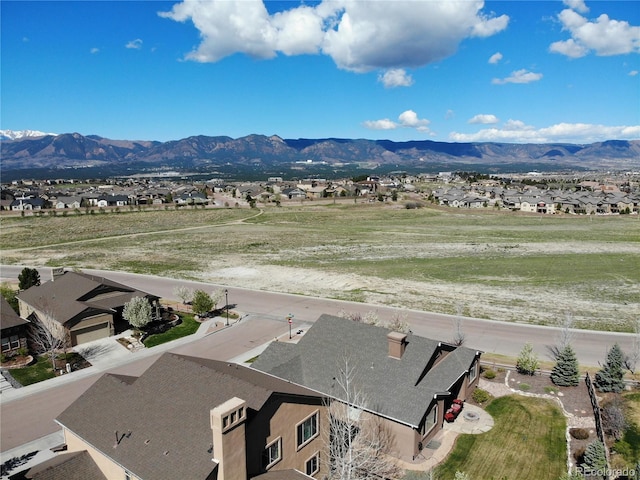 aerial view of residential area with a mountain backdrop