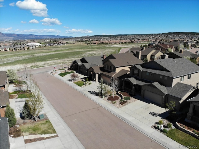 aerial view of residential area with mountains