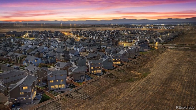 aerial view at dusk with a mountain view