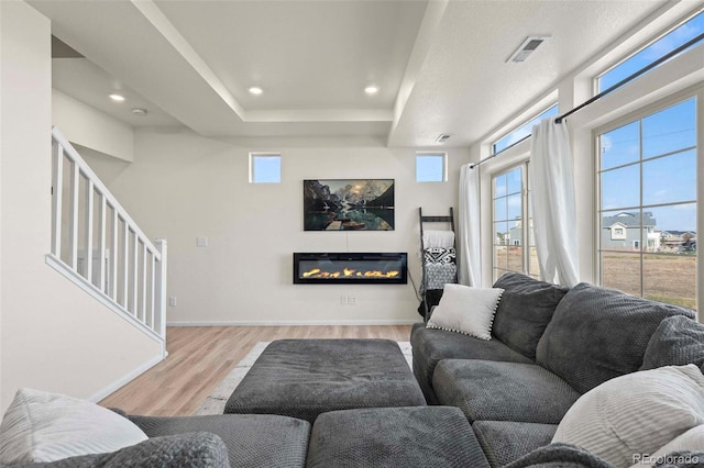 living room with light hardwood / wood-style flooring