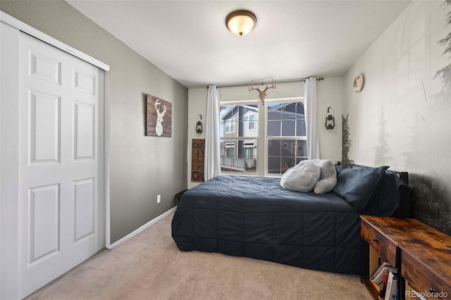 carpeted bedroom with a textured ceiling