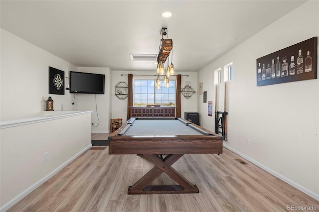 rec room with pool table and light hardwood / wood-style floors