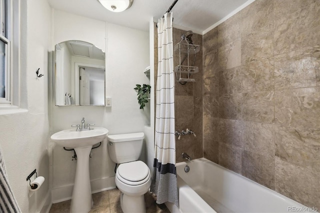 bathroom with toilet, shower / bathtub combination with curtain, tile patterned floors, baseboards, and a sink