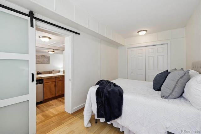 1532 N High St Unit 1, Denver, CO 80218 - bedroom with light wood-style floors, a closet, and ensuite bathroom
