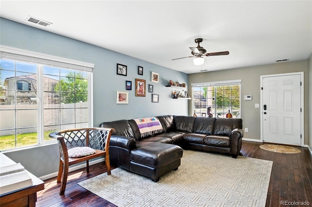 5552 Odessa St, Denver, CO 80249 - living area with ceiling fan, dark wood-style floors, and baseboards