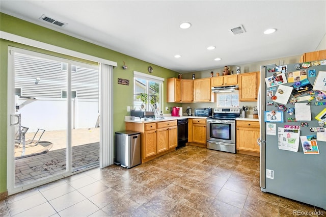 5552 Odessa St, Denver, CO 80249 - kitchen with stainless steel appliances, under cabinet range hood, light countertops, recessed lighting, and a sink