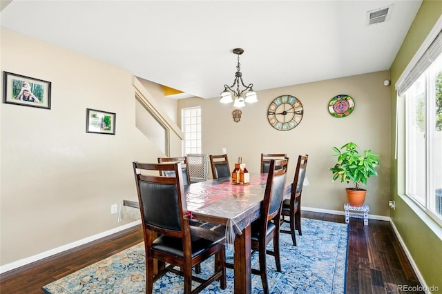 5552 Odessa St, Denver, CO 80249 - dining room with wood-type flooring, baseboards, and a chandelier