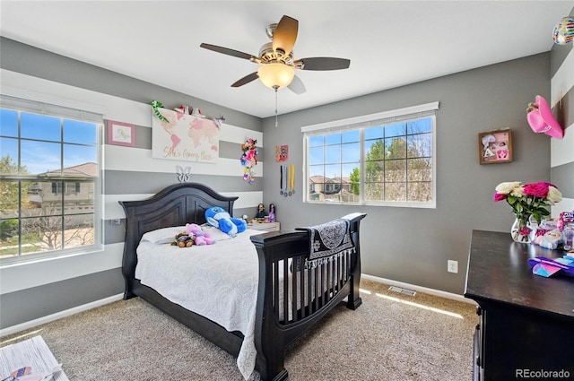 5552 Odessa St, Denver, CO 80249 - bedroom with multiple windows, carpet floors, and baseboards