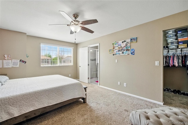 5552 Odessa St, Denver, CO 80249 - bedroom featuring light colored carpet, a spacious closet, baseboards, ceiling fan, and ensuite bathroom