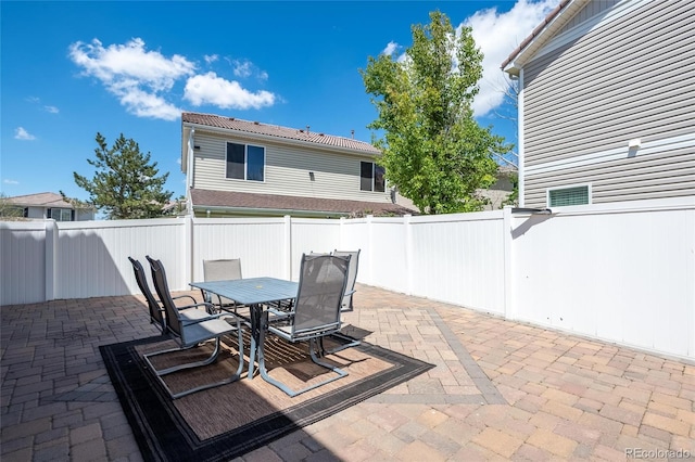 5552 Odessa St, Denver, CO 80249 - view of patio featuring a fenced backyard and outdoor dining space