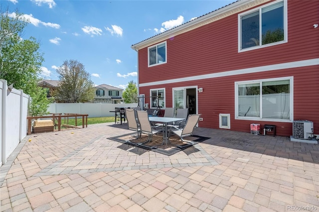 5552 Odessa St, Denver, CO 80249 - view of patio featuring outdoor dining area, fence, and central AC