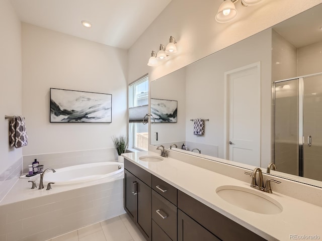 full bath featuring a garden tub, a sink, and a stall shower