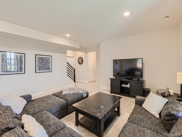 living room featuring light colored carpet, recessed lighting, baseboards, visible vents, and stairway