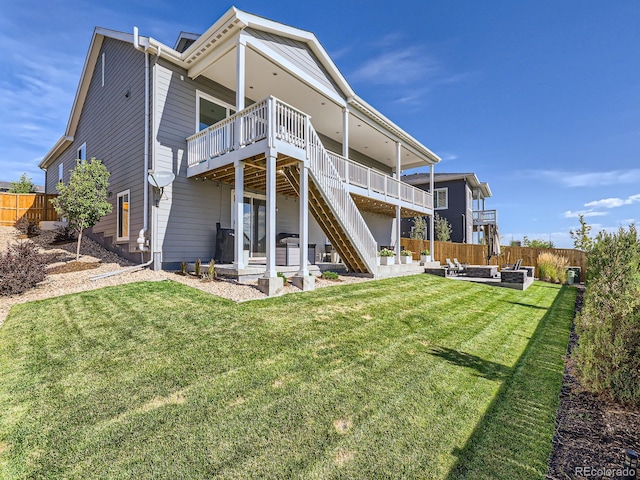 rear view of house with outdoor lounge area, fence, a deck, a patio, and stairway