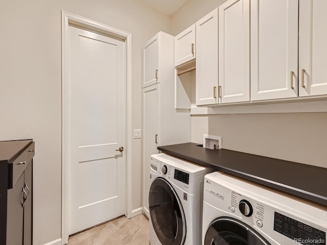 laundry room with cabinet space and washer and dryer
