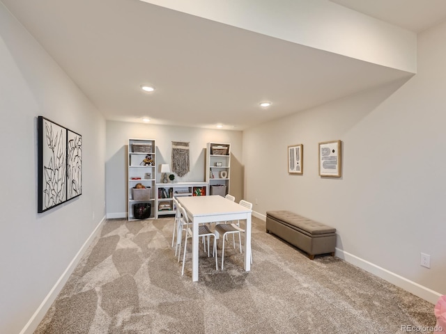 dining area featuring recessed lighting, baseboards, and light carpet