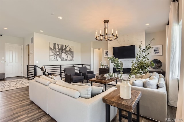 14440 Hop Clover Trl, Parker, CO 80134 - living area featuring a chandelier, dark wood finished floors, recessed lighting, and baseboards