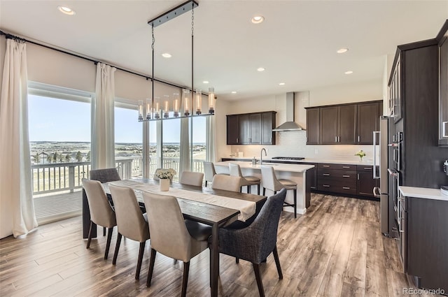 14440 Hop Clover Trl, Parker, CO 80134 - dining space featuring light wood finished floors, a water view, and recessed lighting