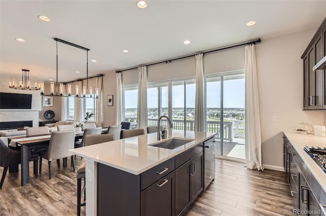 14440 Hop Clover Trl, Parker, CO 80134 - kitchen with a sink, appliances with stainless steel finishes, healthy amount of natural light, open floor plan, and recessed lighting