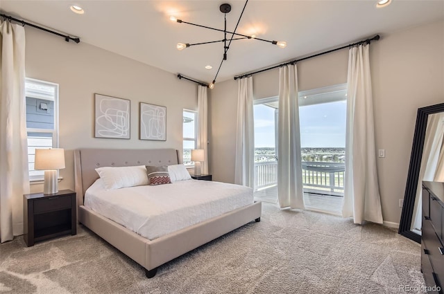 14440 Hop Clover Trl, Parker, CO 80134 - bedroom with light carpet, access to outside, recessed lighting, and a chandelier