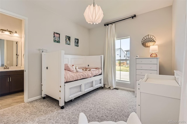 14440 Hop Clover Trl, Parker, CO 80134 - bedroom featuring a sink, light colored carpet, and ensuite bathroom