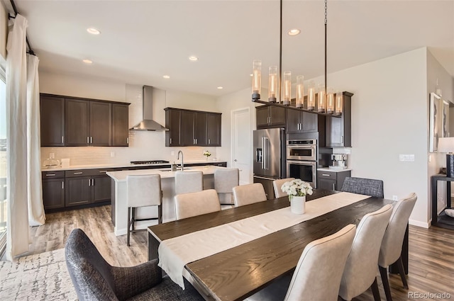 14440 Hop Clover Trl, Parker, CO 80134 - dining space featuring light wood finished floors, recessed lighting, and baseboards