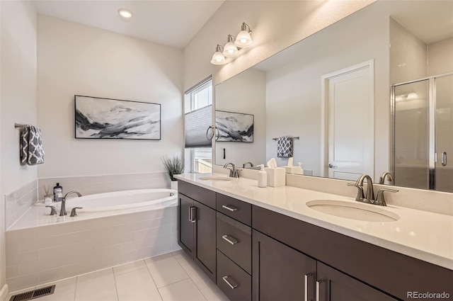 14440 Hop Clover Trl, Parker, CO 80134 - bathroom with a garden tub, a stall shower, tile patterned flooring, and double vanity