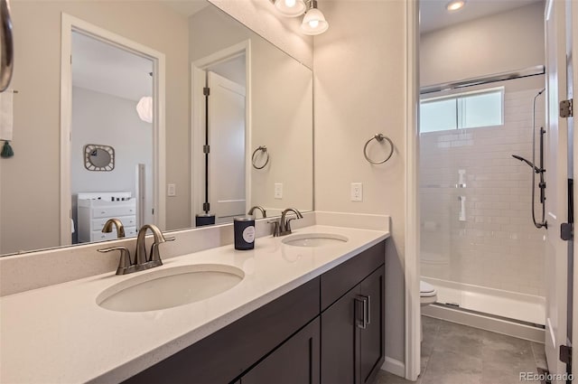 14440 Hop Clover Trl, Parker, CO 80134 - full bath featuring a stall shower, toilet, double vanity, and tile patterned floors