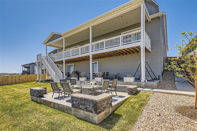 14440 Hop Clover Trl, Parker, CO 80134 - rear view of house with a fire pit, stairway, a patio, and a wooden deck
