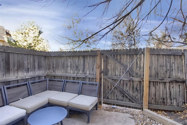 view of patio featuring a fenced backyard and outdoor lounge area