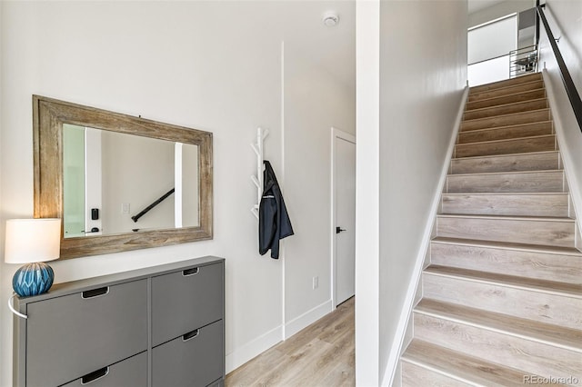 5385 W 14th Ave, Lakewood, CO 80214 - staircase with wood finished floors and baseboards