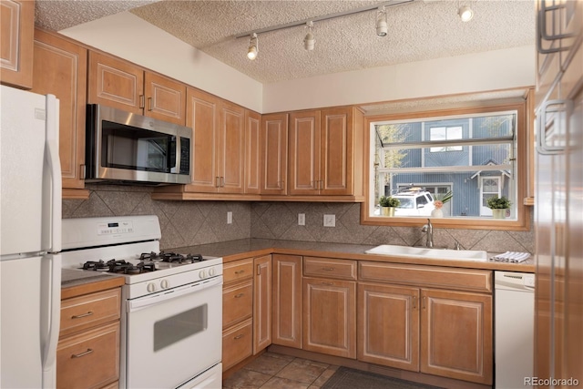 218 Highland Ter, Breckenridge, CO 80424 - kitchen featuring white appliances, backsplash, a textured ceiling, and light tile patterned flooring