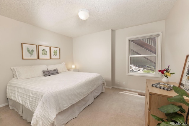 218 Highland Ter, Breckenridge, CO 80424 - bedroom featuring light colored carpet and a textured ceiling