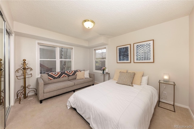 218 Highland Ter, Breckenridge, CO 80424 - bedroom featuring light colored carpet, a textured ceiling, and a closet