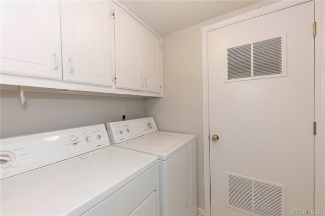 218 Highland Ter, Breckenridge, CO 80424 - laundry room featuring washing machine and clothes dryer, cabinet space, and a textured ceiling