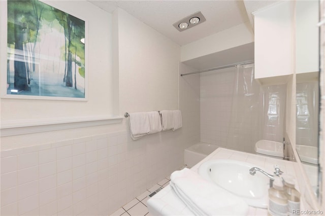 218 Highland Ter, Breckenridge, CO 80424 - bathroom with tile walls, tub / shower combination, and vanity